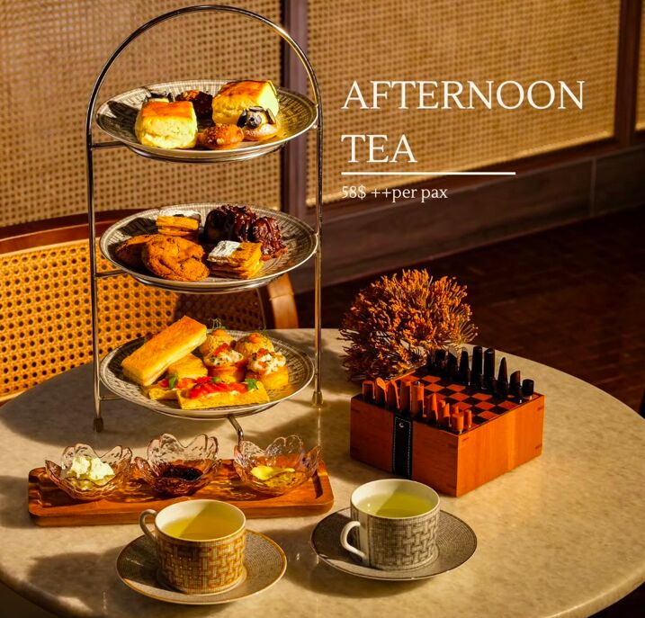Three-tier afternoon tea stand with pastries and savouries